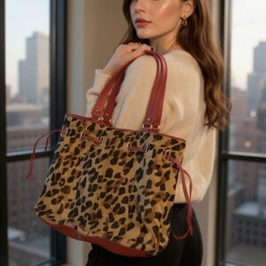 Animal print, red leather detail, tote style.